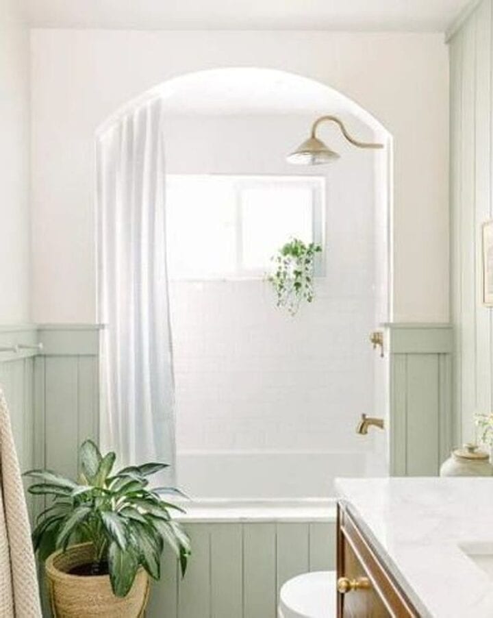 bathtub surround with green vertical shiplap paneling