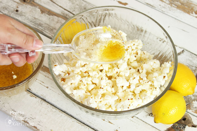 drizzle-butter-mixture-over-popcorn Lemon Zest Popcorn {Gift Idea} | Pretty Handy Girl