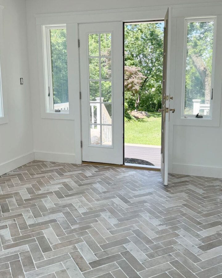 herringbone-brick-flooring-in-sunroom-enlcosed-porch