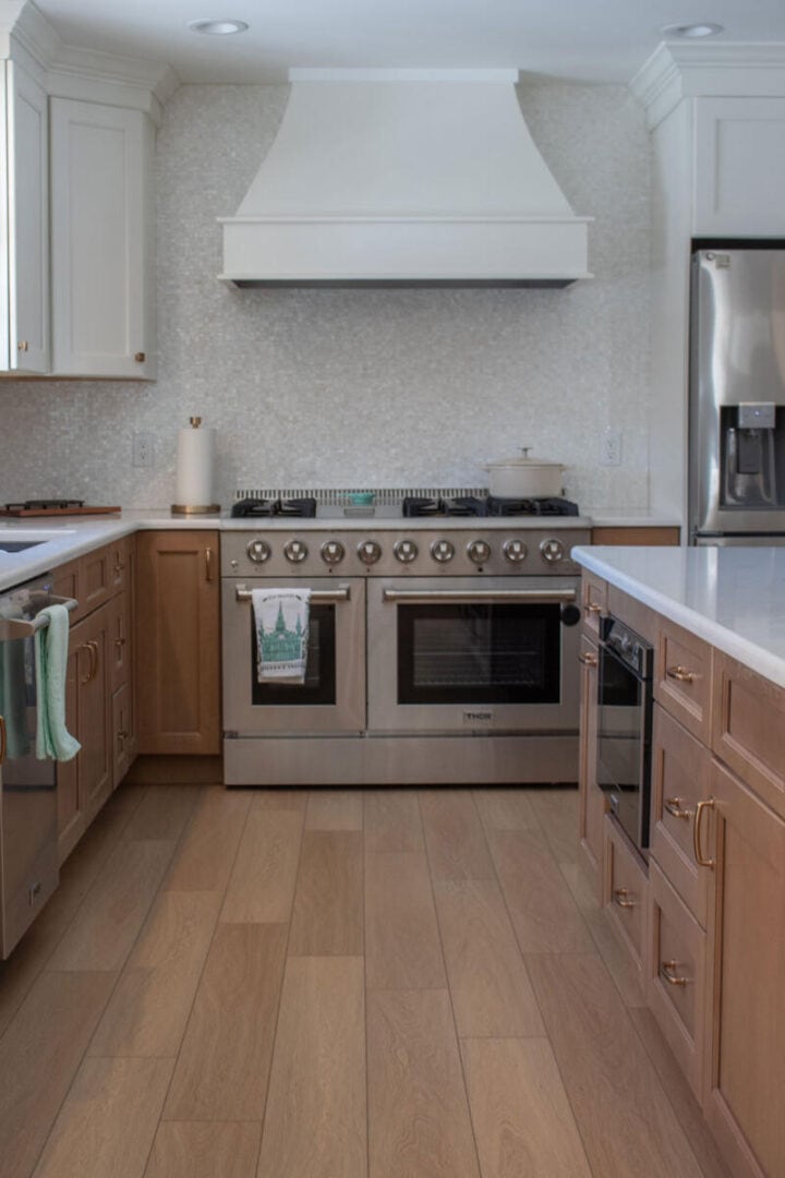 range-hood-curved-style-in-modern-kitchen - white and brown kitchen cabinets ideas