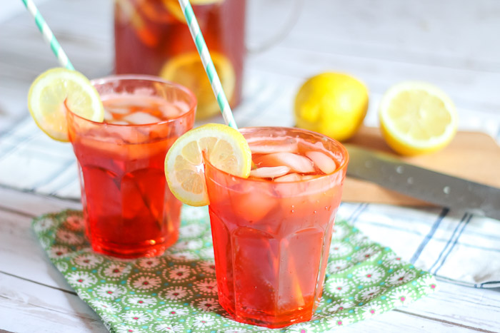 Sun tea in glasses topped with lemon slices